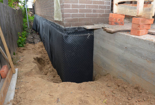 SJ Waterproofing Pros technician performing targeted Sump Pump Installation assessment in Adamsville, TN